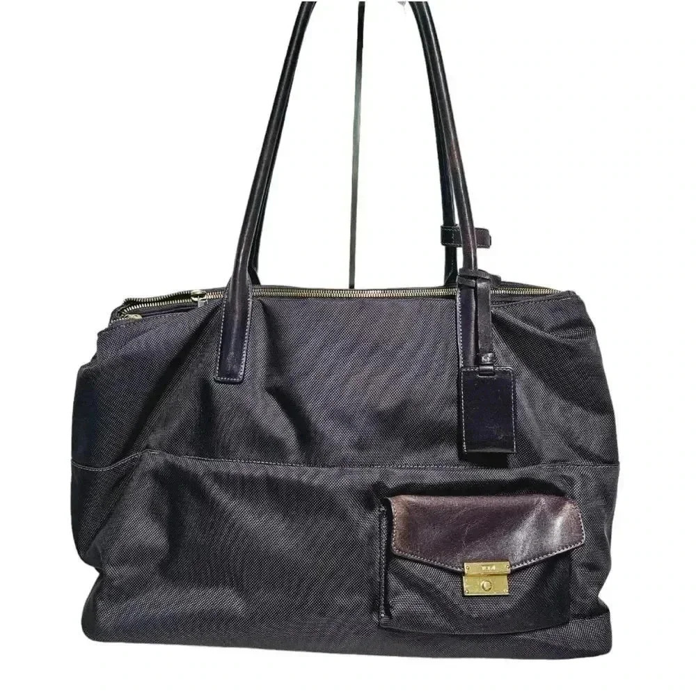 Tumi Hayes Larkin Aubargine triple compartment briefcase travel bag